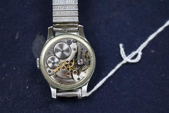 A gentlemans 1940s steel cased Longines manual wind wrist watch, on associated flexible strap.
